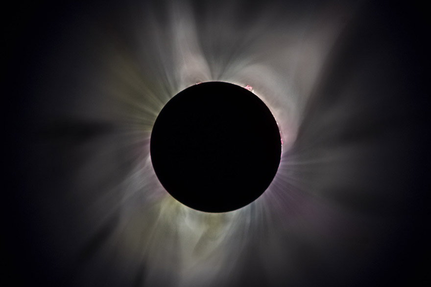 Corona of the sun at totality, six-photo composite.